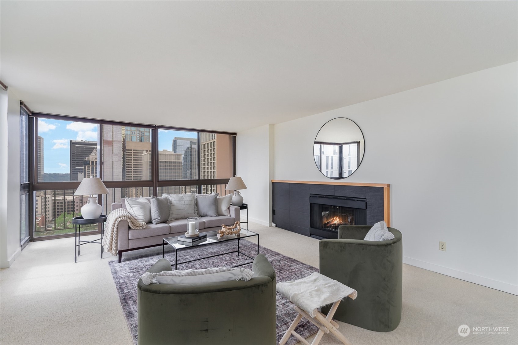 1120 8th Avenue, Unit 1601 Seattle, WA 98101 - Photo 4 of 30 a living room with furniture and a fireplace