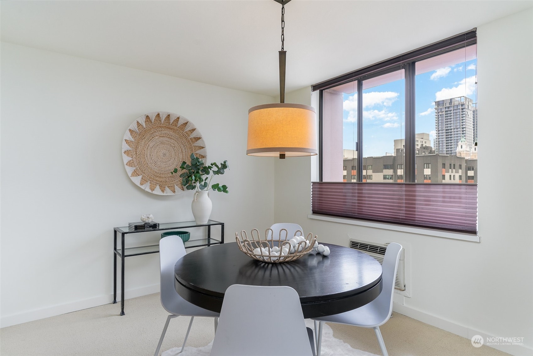 1120 8th Avenue, Unit 1601 Seattle, WA 98101 - Photo 10 of 30 a dining room with furniture and a window