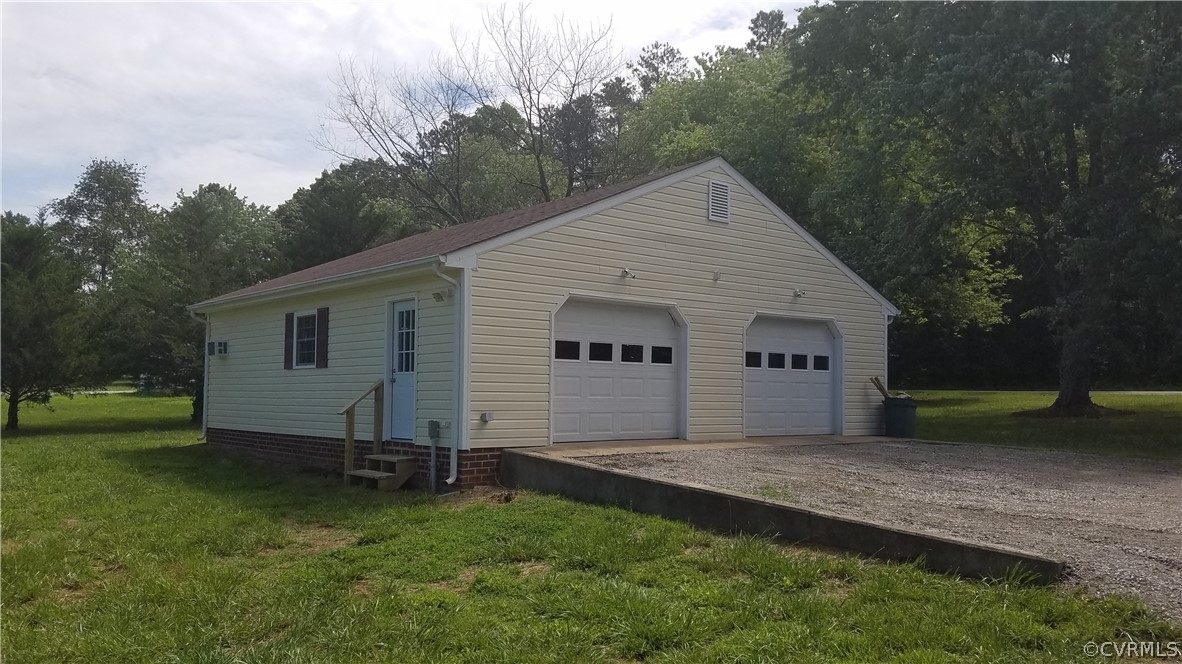 923 Schroeder Road Powhatan, VA 23139 - Photo 26 of 32 Custom-built 2-car garage w/ over 1,000 sqft and o