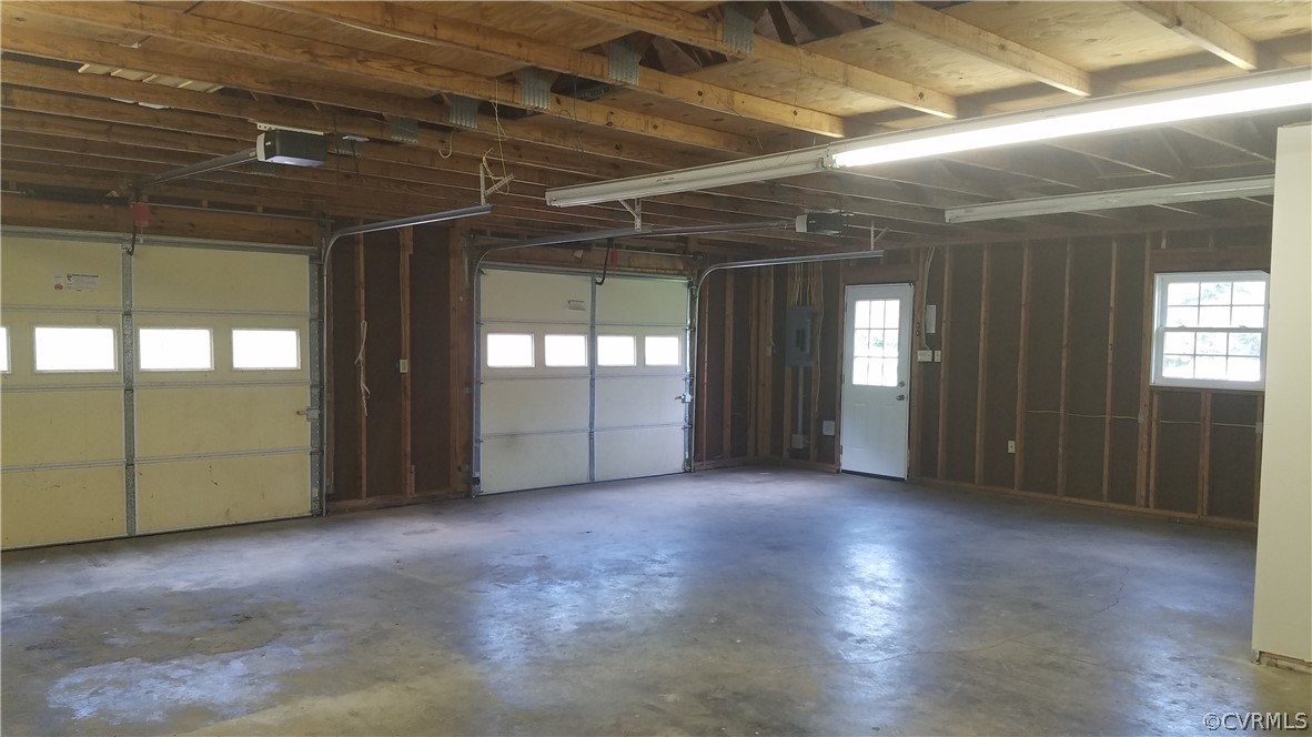 923 Schroeder Road Powhatan, VA 23139 - Photo 27 of 32 Interior of well-lit garage w/ overhead storage (p