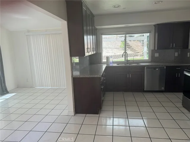 a kitchen with appliances and cabinets