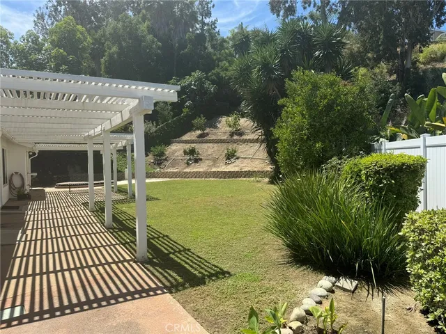 a view of a chairs and table in the patio