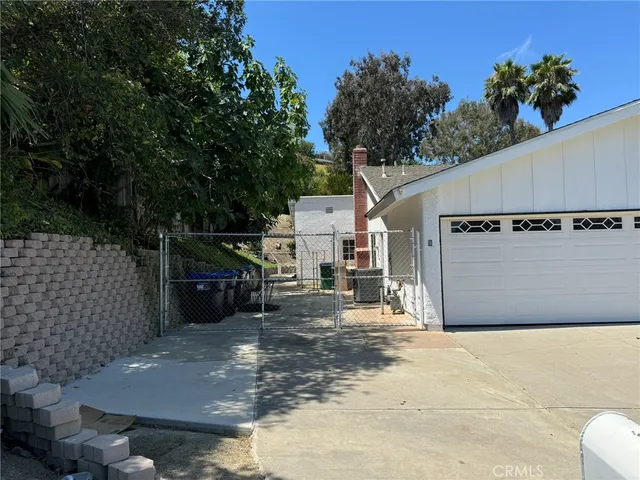 a kitchen with granite countertop stainless steel appliances cabinets and a sink
