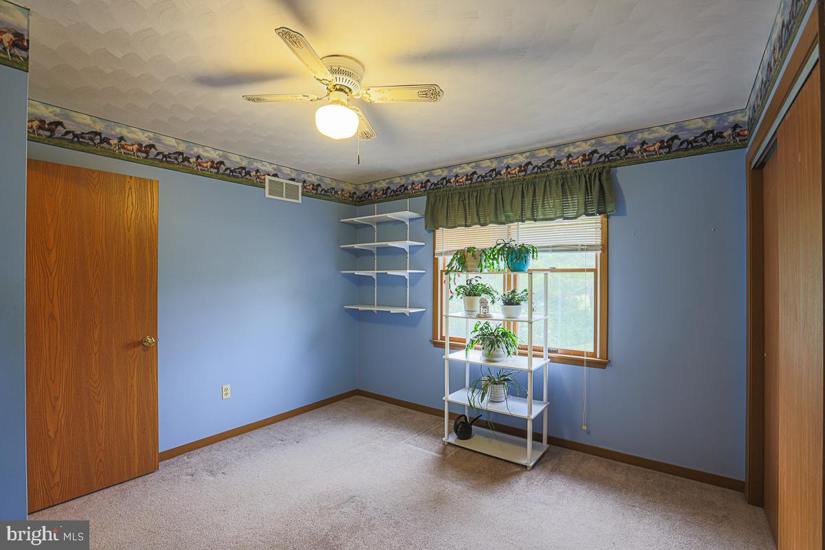 3899 Bixler Church Road Westminster, MD 21158 - Photo 11 of 42 a view of an empty room with a window