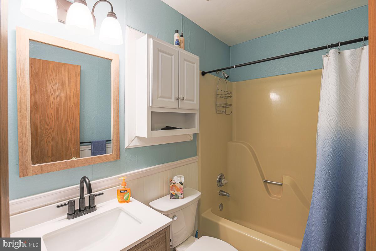 3899 Bixler Church Road Westminster, MD 21158 - Photo 12 of 42 a bathroom with a sink toilet and shower
