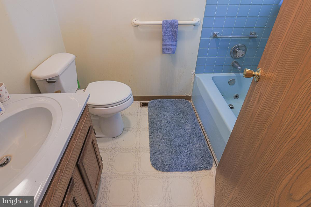 3899 Bixler Church Road Westminster, MD 21158 - Photo 15 of 42 a bathroom with a toilet and a sink