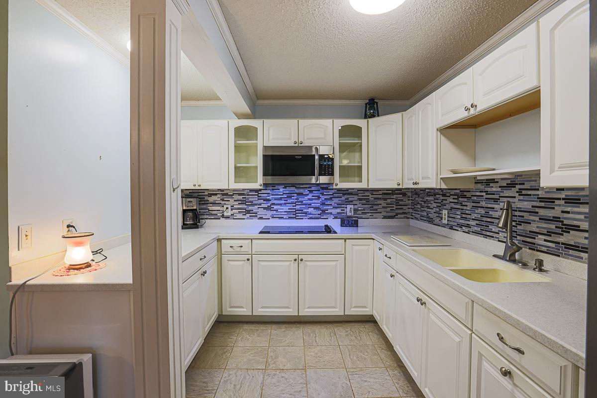 3899 Bixler Church Road Westminster, MD 21158 - Photo 21 of 42 a kitchen with a sink and cabinets