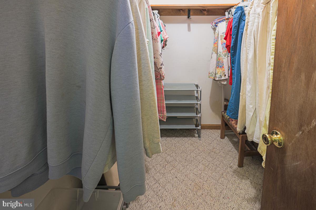 3899 Bixler Church Road Westminster, MD 21158 - Photo 26 of 42 a view of walk in closet with clothes
