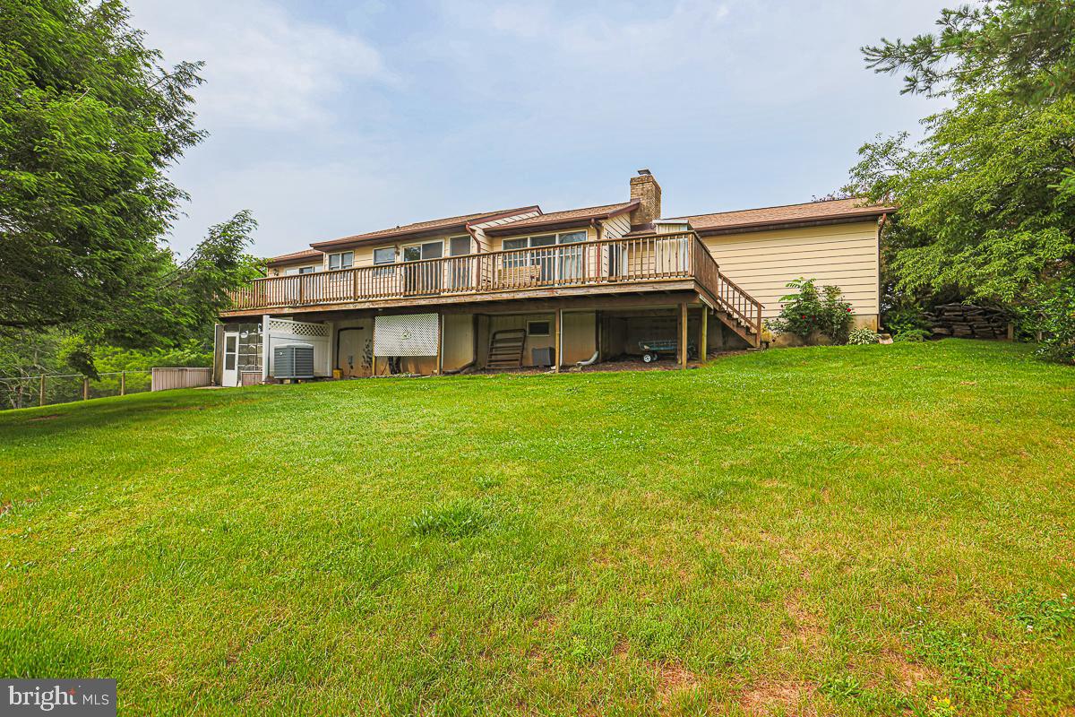 3899 Bixler Church Road Westminster, MD 21158 - Photo 5 of 42 a view of a house next to a big yard and large trees