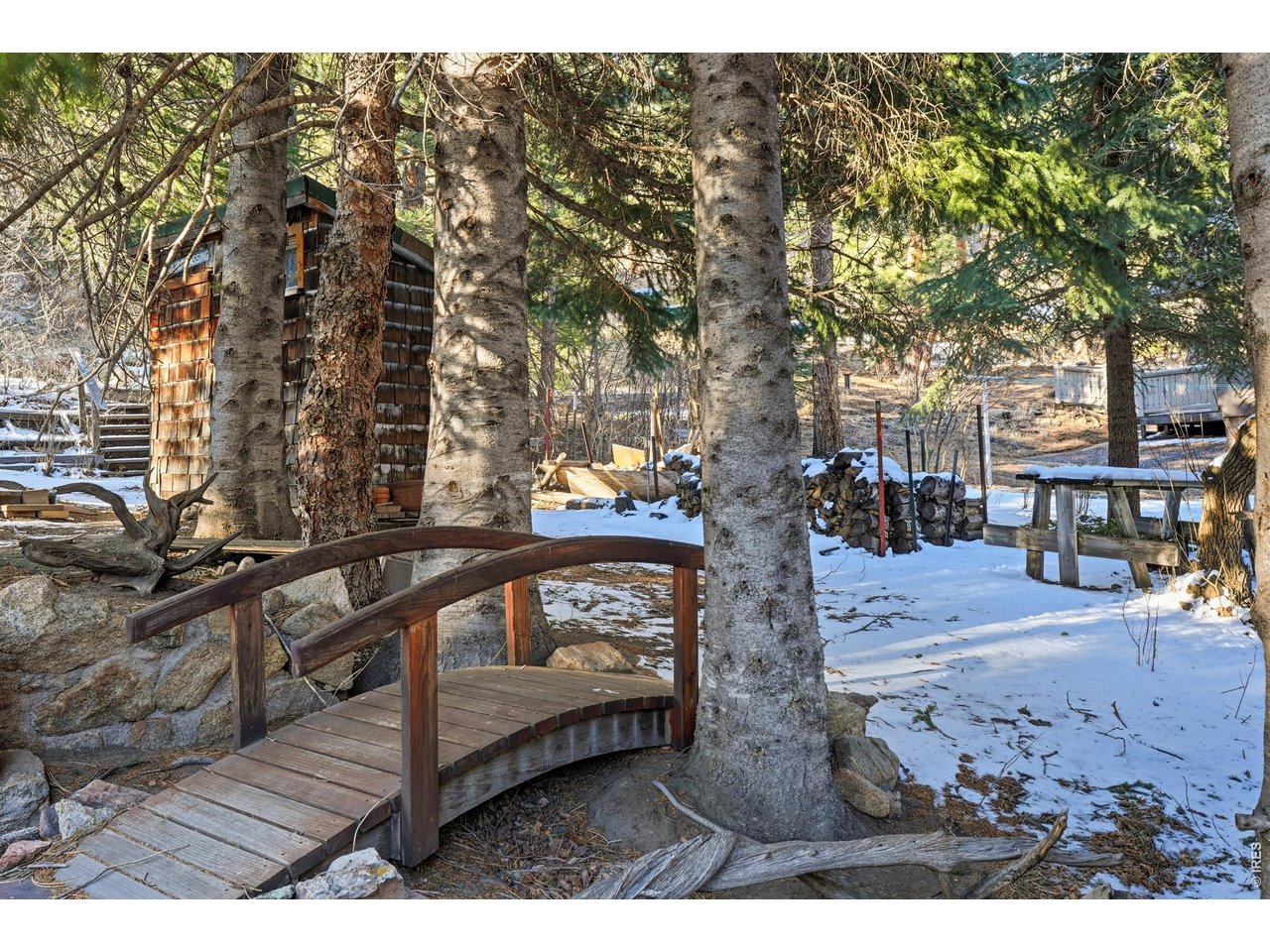 2476 Riverside Drive Lyons, CO 80540 - Photo 38 of 42 a view of a wooden deck with chairs