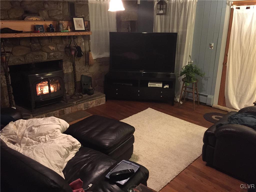 308 Frailey Road Stroudsburg, PA 18360 - Photo 18 of 42 a living room with furniture and a fireplace