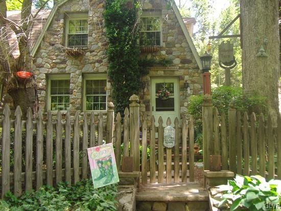 308 Frailey Road Stroudsburg, PA 18360 - Photo 2 of 42 a view of a brick house with a fountain plants and large trees