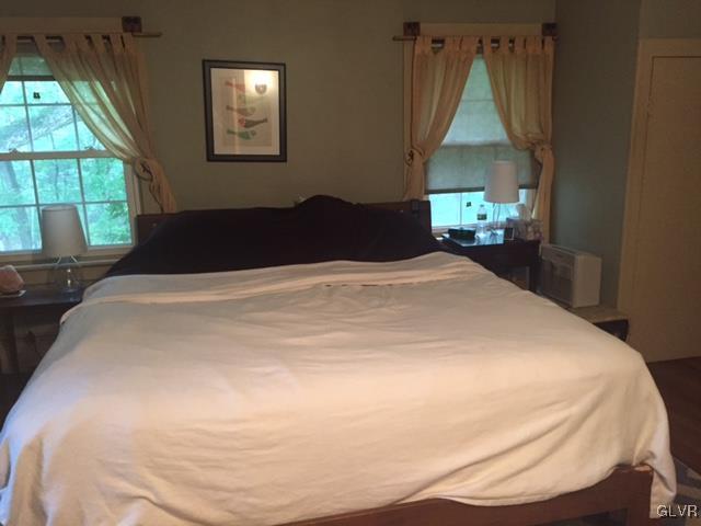 308 Frailey Road Stroudsburg, PA 18360 - Photo 21 of 42 a bed sitting in a bedroom next to a window