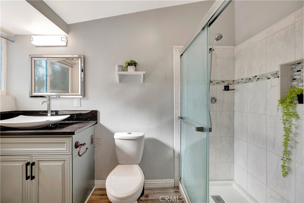 1770 Wright Street Pomona, CA 91766 - Photo 19 of 70 a bathroom with a granite countertop toilet sink and shower