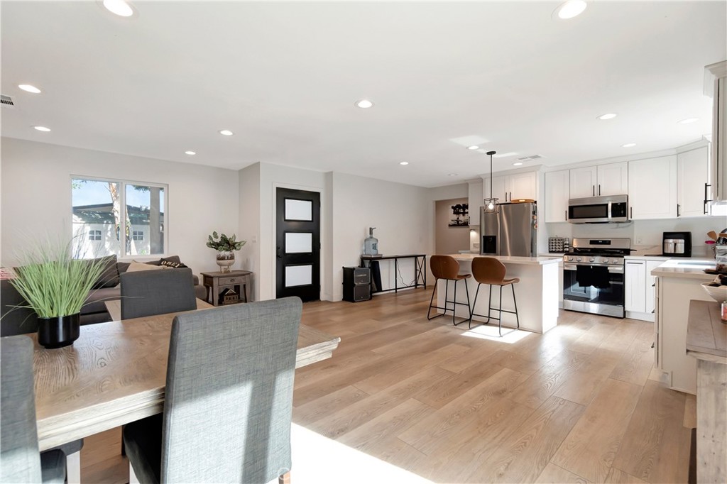 1770 Wright Street Pomona, CA 91766 - Photo 35 of 70 a living room with furniture and kitchen view with wooden floor
