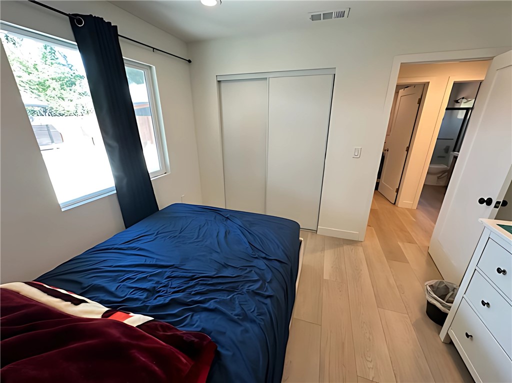 1770 Wright Street Pomona, CA 91766 - Photo 44 of 70 a bedroom with a bed and a mirror