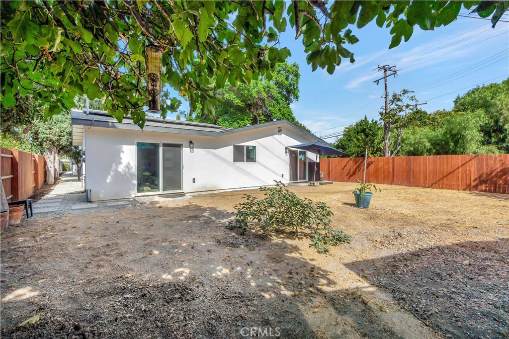 1770 Wright Street Pomona, CA 91766 - Photo 49 of 70 a front view of house with yard and trees in the background