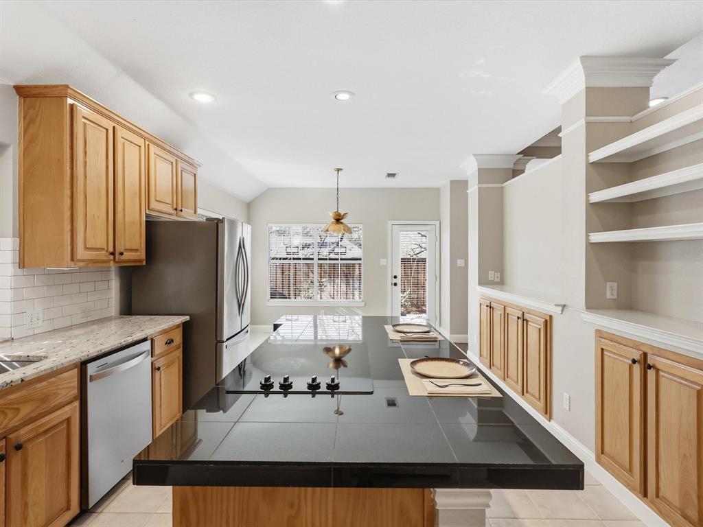 2211 Post Oak Circle Corinth, TX 76210 - Photo 16 of 40 a kitchen with refrigerator and window