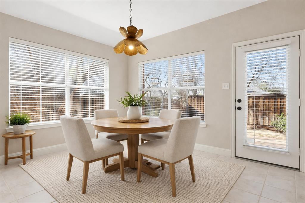 2211 Post Oak Circle Corinth, TX 76210 - Photo 18 of 40 a view of a dining room with furniture and windows
