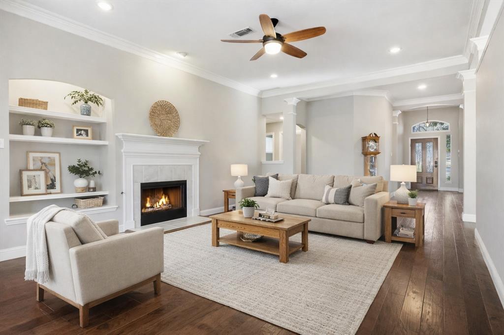 2211 Post Oak Circle Corinth, TX 76210 - Photo 19 of 40 a living room with furniture and a fireplace