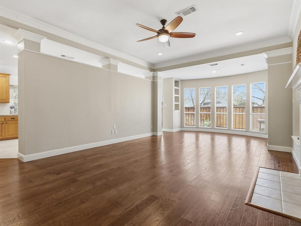 2211 Post Oak Circle Corinth, TX 76210 - Photo 22 of 40 a view of an empty room with a window and wooden floor