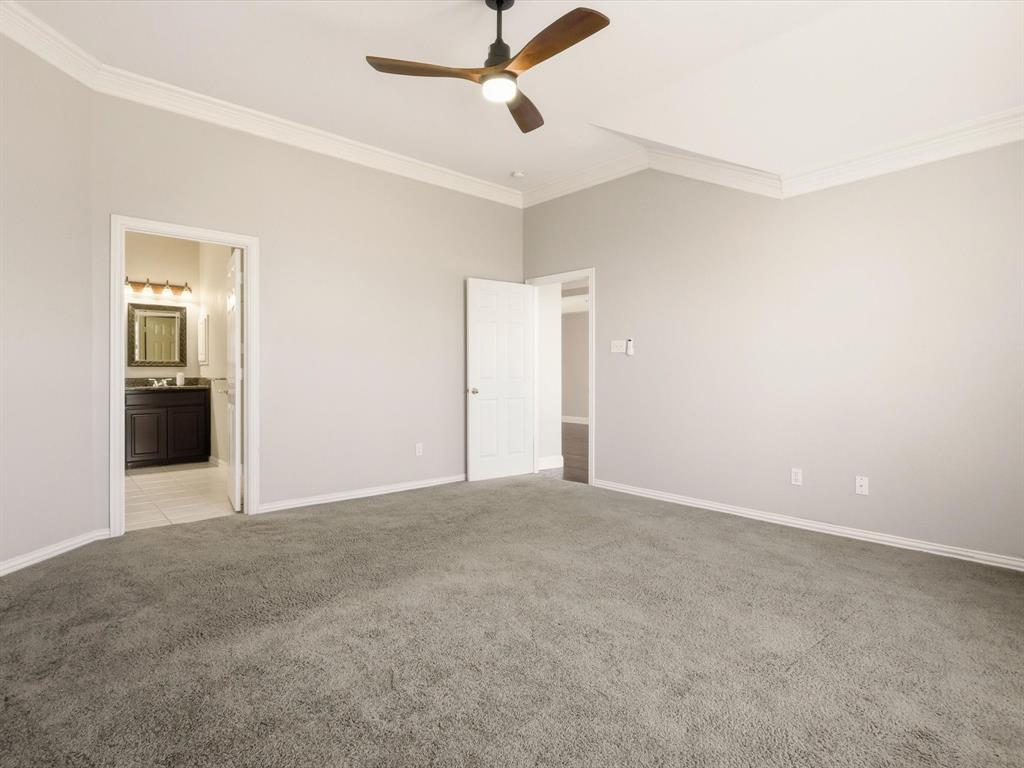 2211 Post Oak Circle Corinth, TX 76210 - Photo 27 of 40 an empty room with closet and windows