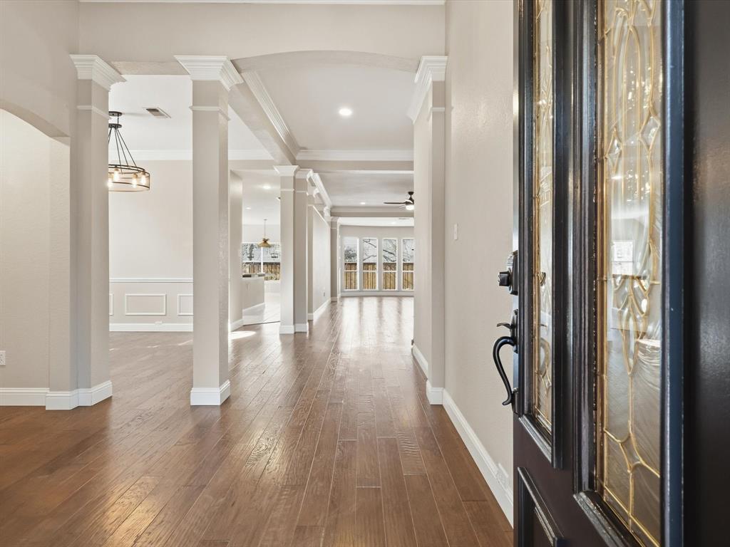 2211 Post Oak Circle Corinth, TX 76210 - Photo 6 of 40 a view of a hallway with wooden floor and staircase