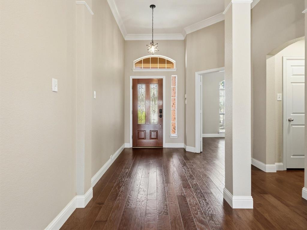 2211 Post Oak Circle Corinth, TX 76210 - Photo 40 of 40 a view of a room with wooden floor air conditioner and a window