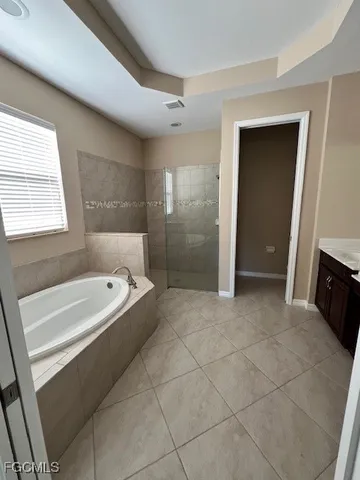 a bathroom with a bathtub and a sink