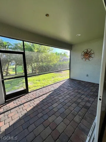 a view of empty room with floor to ceiling window