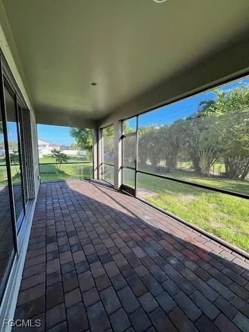 a view of an empty room with a large window