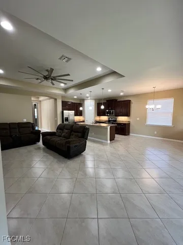 a living room with furniture and a rug