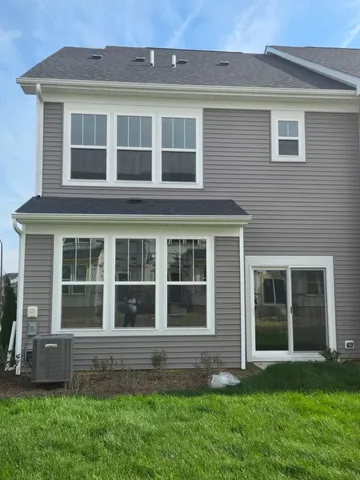 a large brick building with a garden