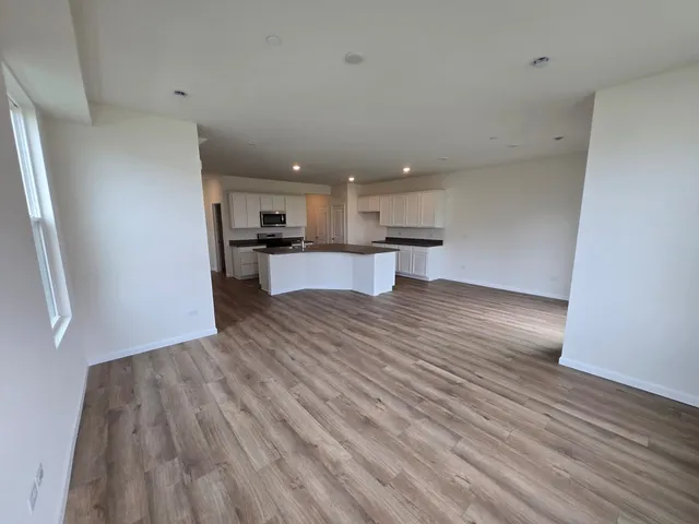 a view of kitchen and wooden floor