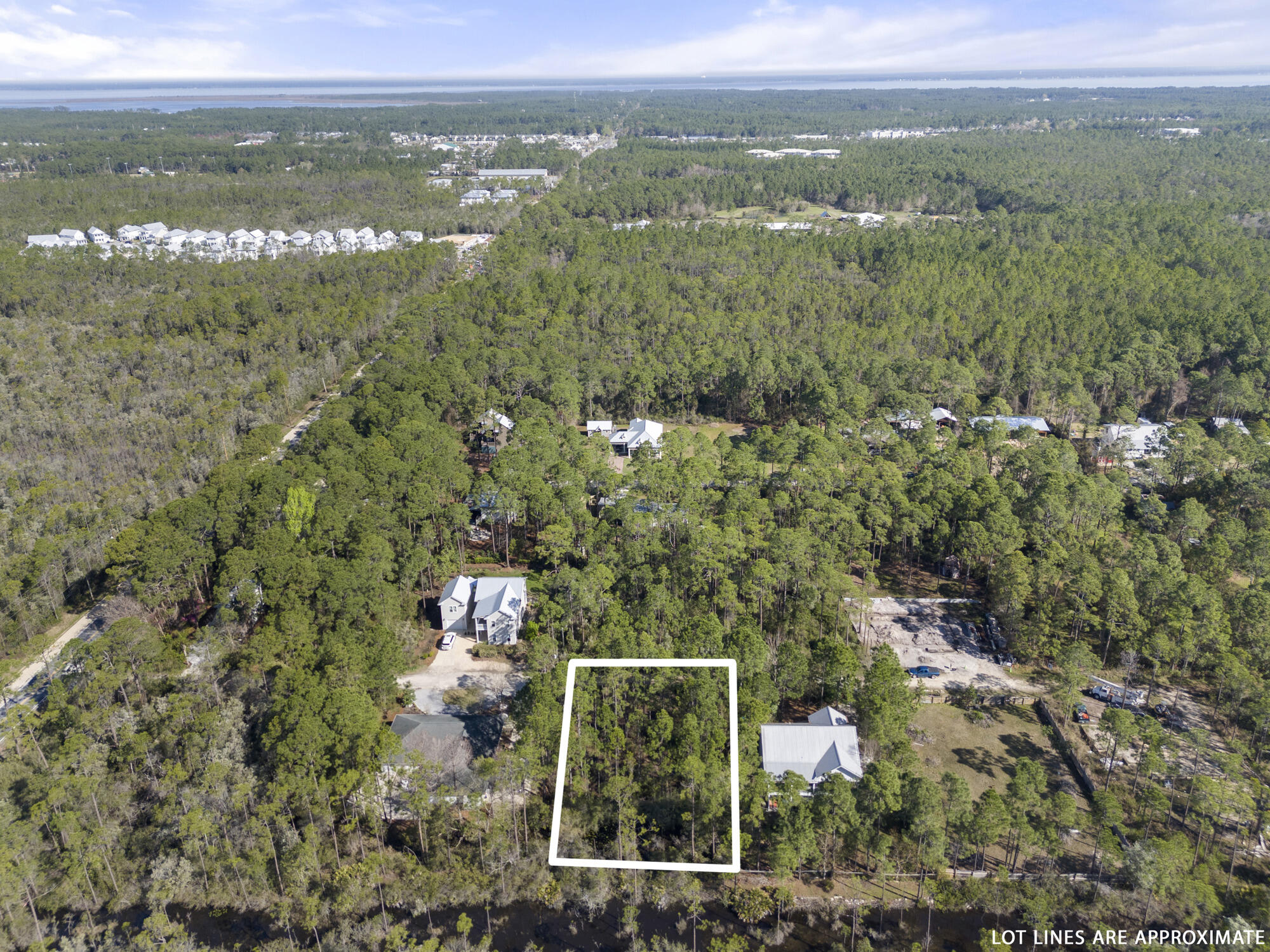 Lot 4 Calm Gulf Drive Santa Rosa Beach, FL 32459 - Photo 27 of 36 a view of a city with lush green forest