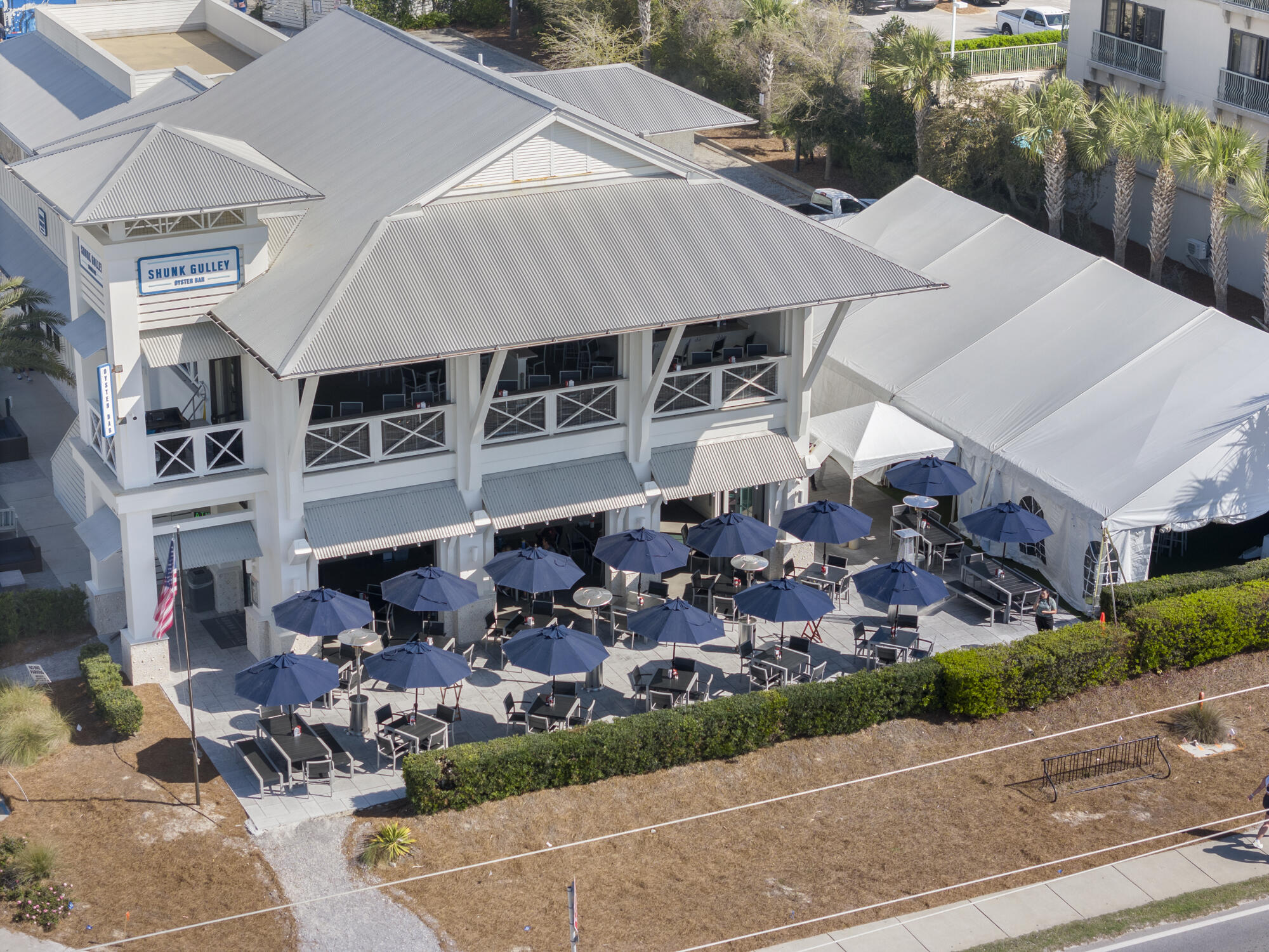 Lot 4 Calm Gulf Drive Santa Rosa Beach, FL 32459 - Photo 34 of 36 a view of a patio with table and chairs potted plants