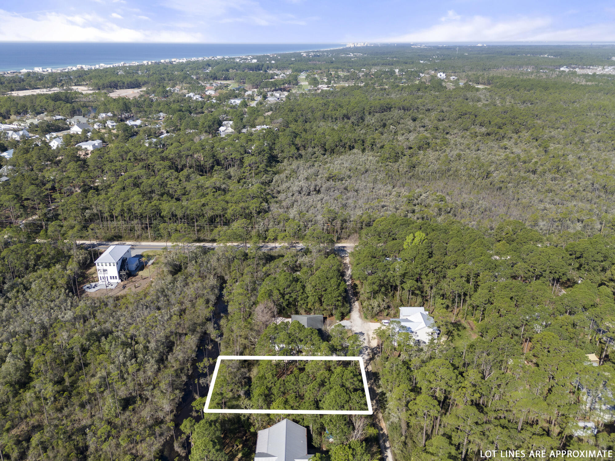 Lot 4 Calm Gulf Drive Santa Rosa Beach, FL 32459 - Photo 10 of 36 an aerial view of house with yard