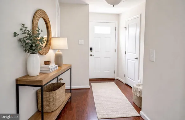 a view of a room with wooden floor and stairs