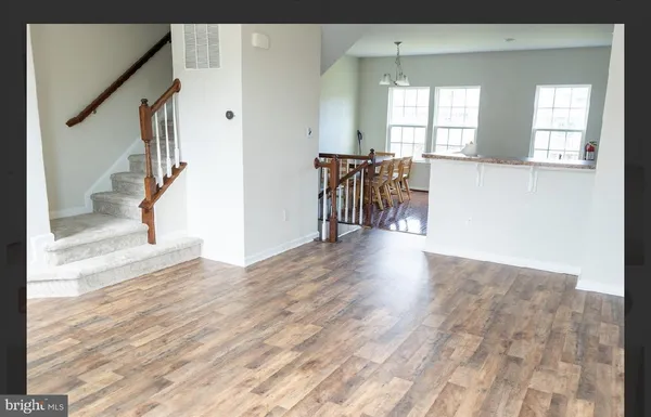 a spacious bedroom with a bed and a couch