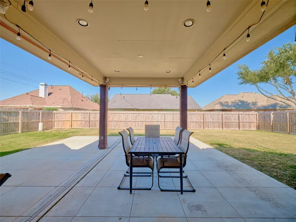 a view of swimming pool with outdoor seating and yard