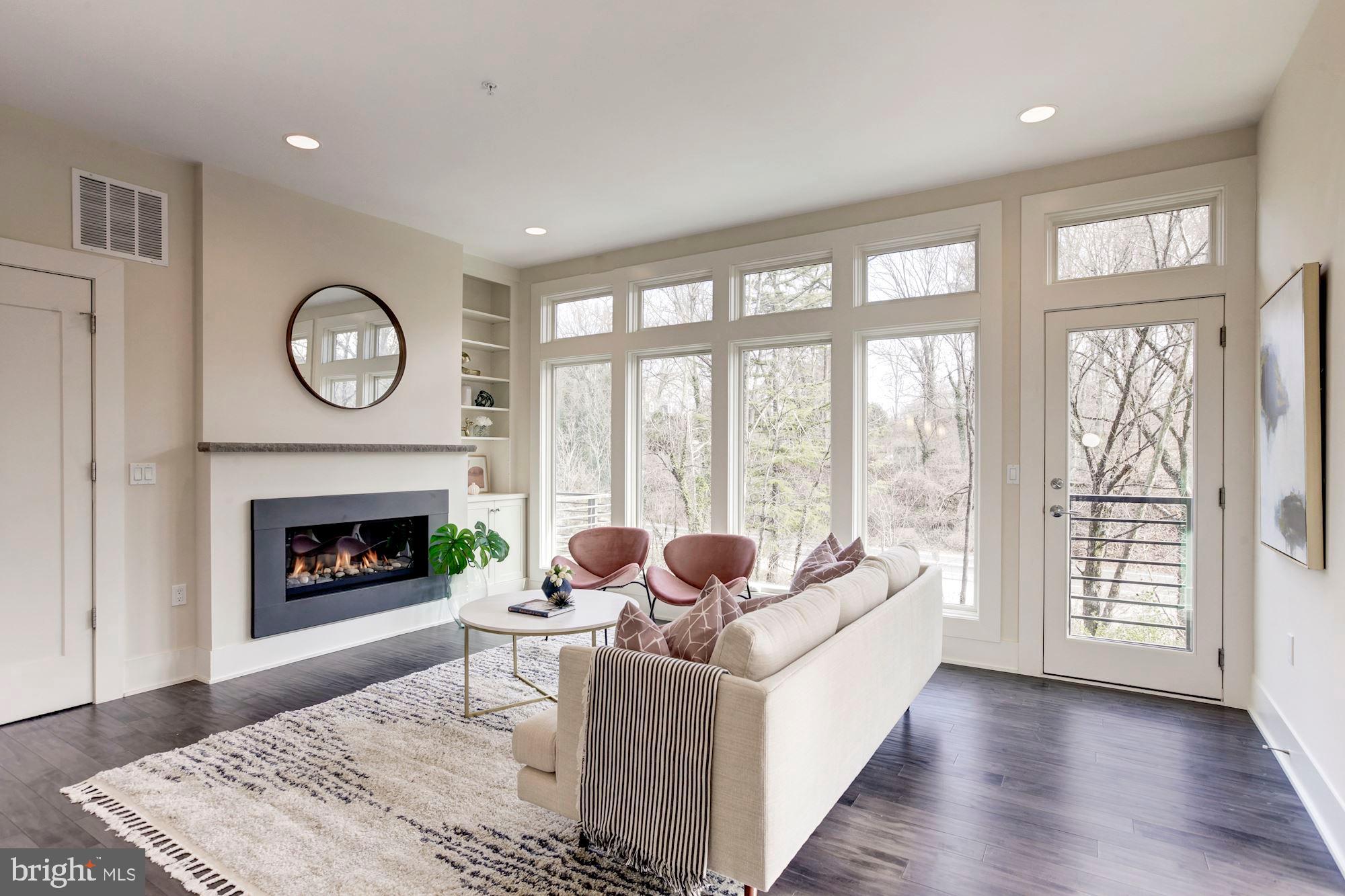 Living Room w/ Gas Fireplace & Wall of Windows