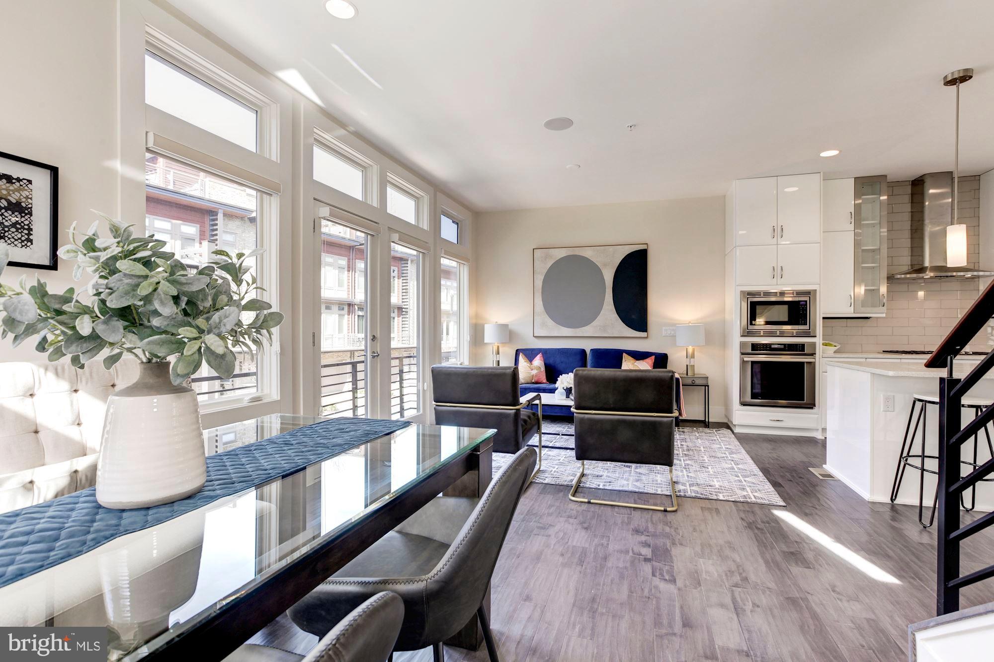 5136 Willet Bridge Road Bethesda, MD 20816 - Photo 10 of 41 Dining & Sitting Area w/ Balcony & Wall of Windows