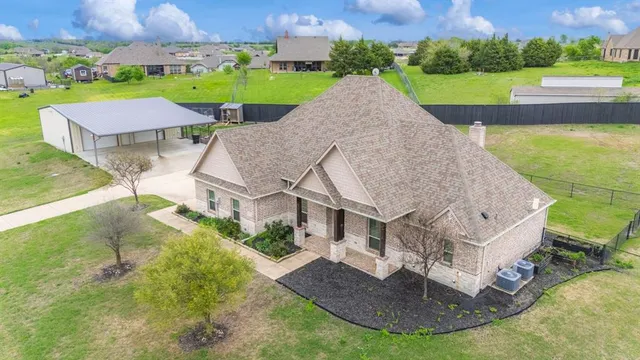 an aerial view of a house with outdoor space patio and mountain view