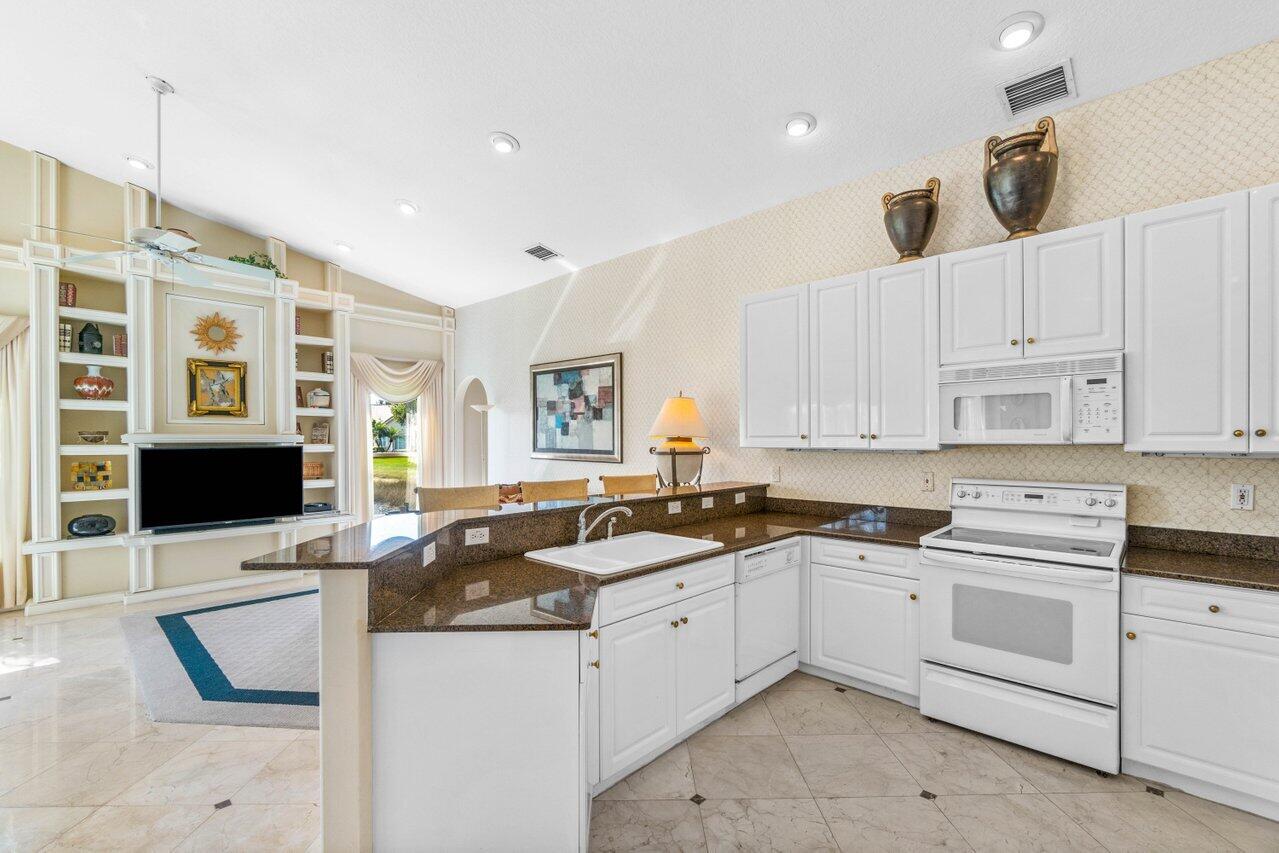 7027 Falls Road East Boynton Beach, FL 33437 - Photo 15 of 33 Kitchen to Family Room