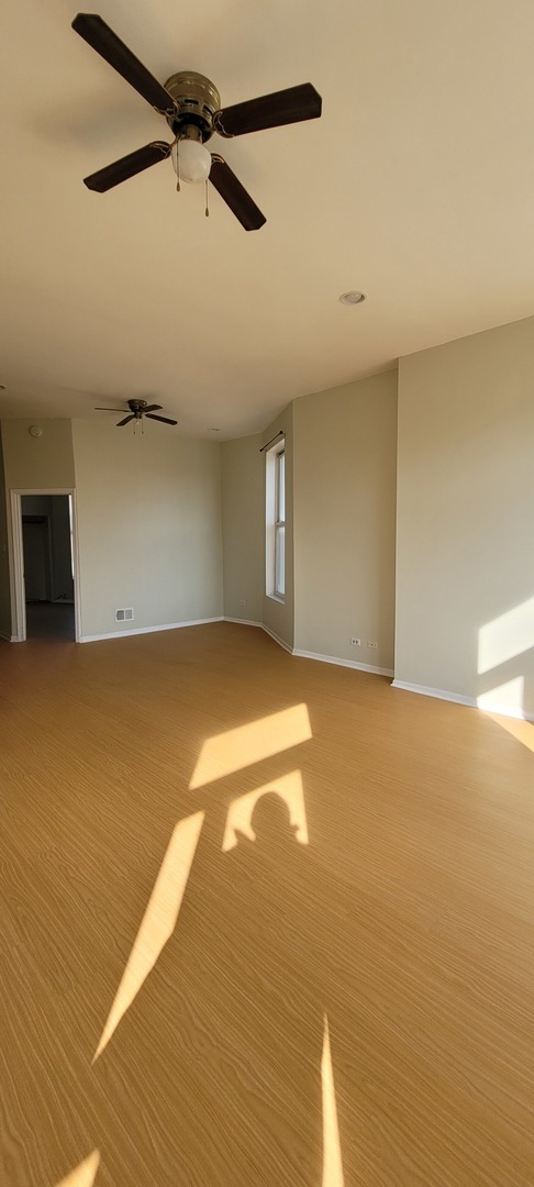 Undisclosed Address Chicago, IL 60624 - Photo 2 of 10 a view of an empty room