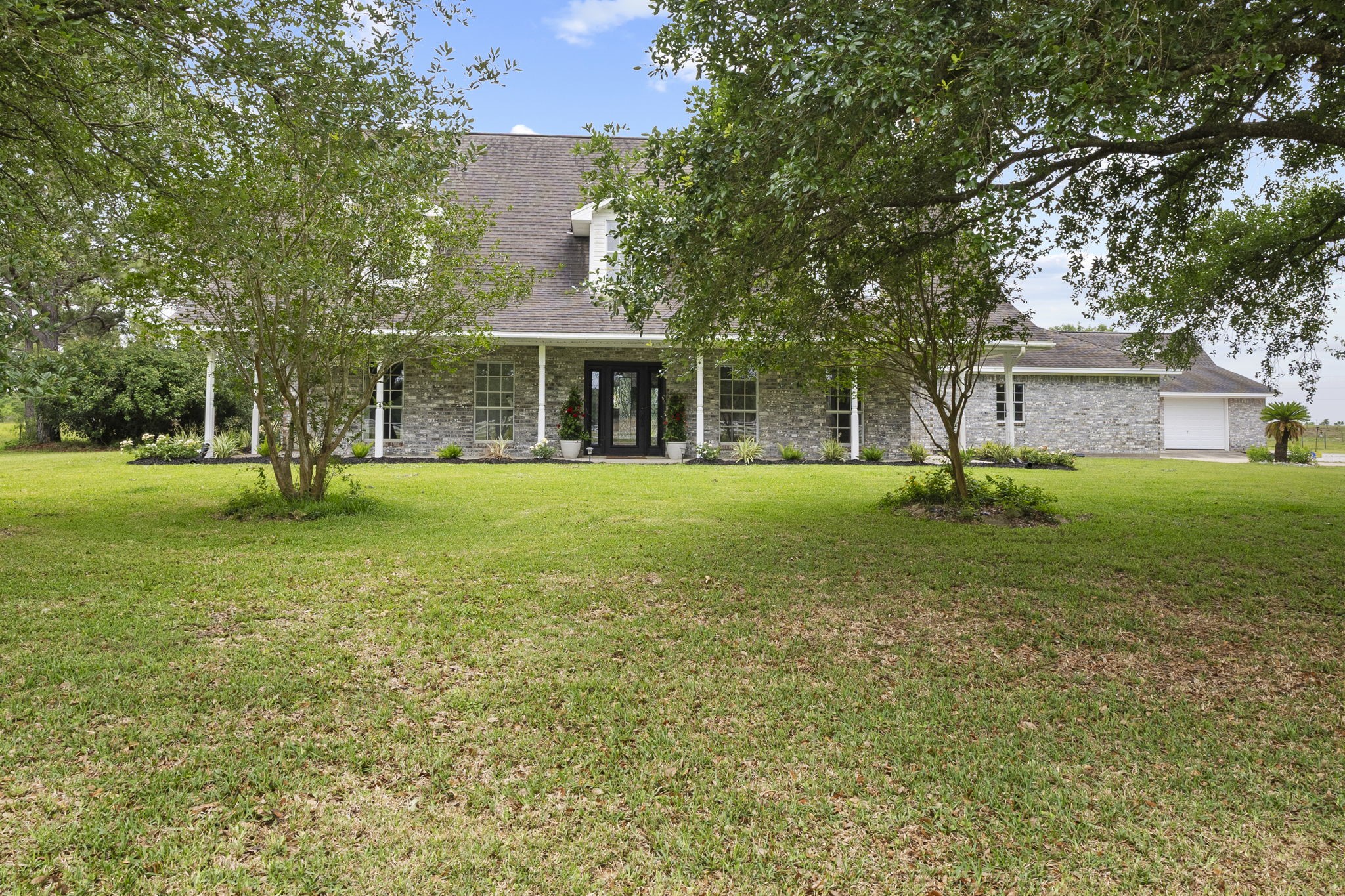 16421 Westbury Road Beaumont, TX 77713 - Photo 4 of 29 a view of a house with a yard
