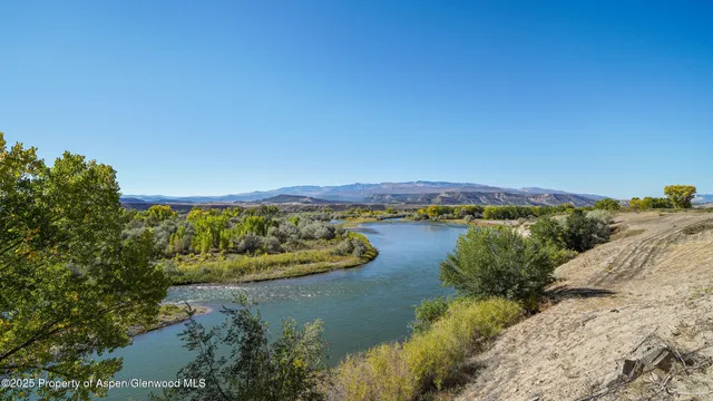 a view of a lake with a mountain in the background