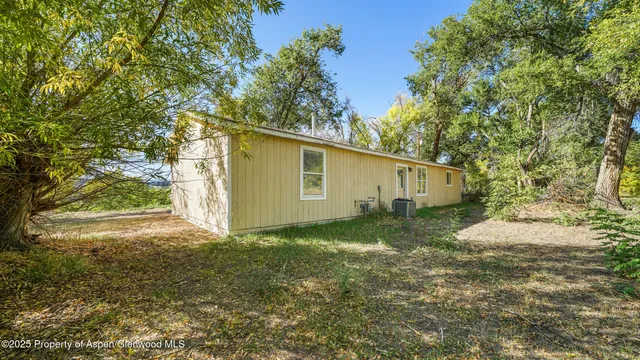 a view of a backyard of the house