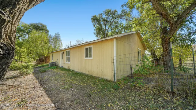 a backyard of a house with lots of green space