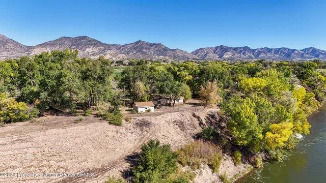 a view of a town with mountains in the background